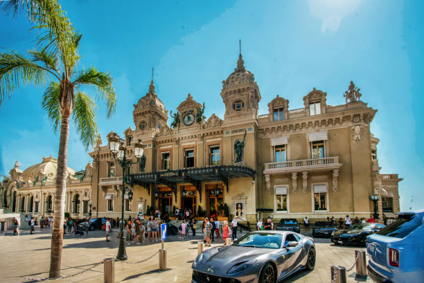 09-01-2022     MONACO     MO    Casino Monte Carlo with the same name of famous district of Monaco small Royalty in the world. Ferrari on foreground
